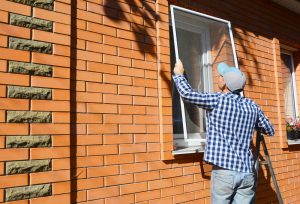 Window screen being installed