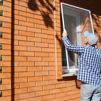 Window screen being installed