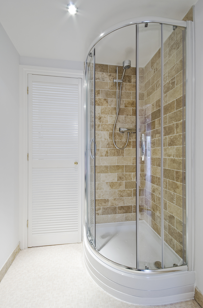 A small rounded glass shower