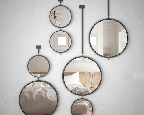 Custom round mirrors installed in a bedroom