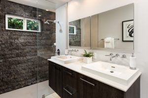 A custom glass mirror in a bathroom