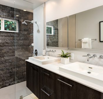 A custom glass mirror in a bathroom