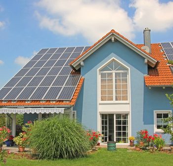 a home with solar panels and ecofriendly windows