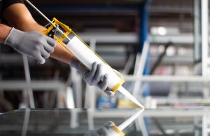 a glass mirror being repaired with resin